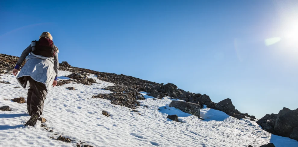 woman-hiking-up-snowy-mountain-on-sunny-day-2026-03-09-04-27-18-utc_result